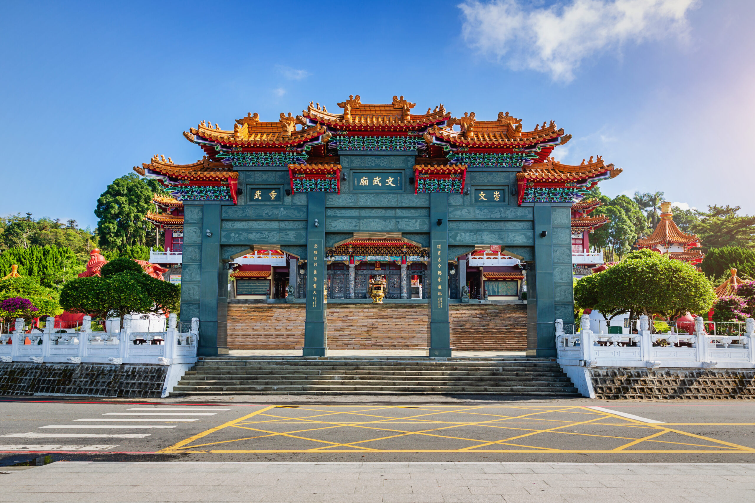 Entrance gate towards the stairway up to Wen Wu Temple at Sun Moon Lake under blue sunny sky. Yuchi, Nantou, Wen Wu Temple, Sun Moon Lake, Taiwan, Asia.
